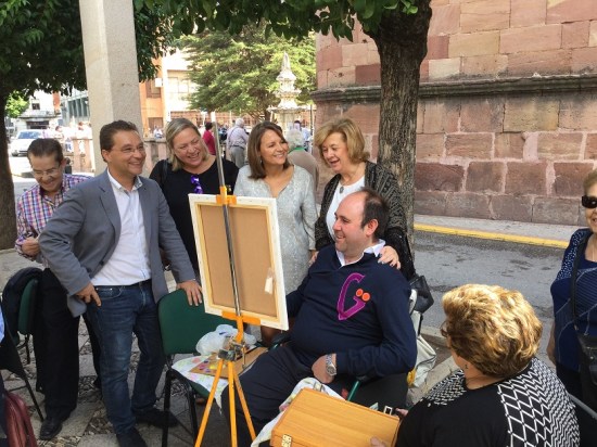 Ana Cobo, Teresa Vega y Francisco Huertas asisten a la celebración del Día del Mayor en Andújar.